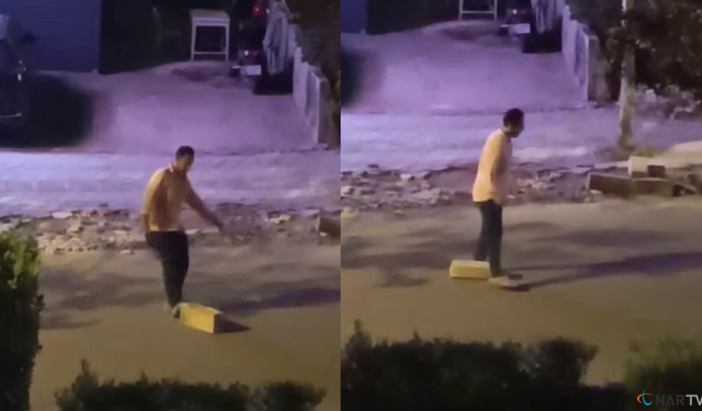 Otostop çektiği araçların durması için yola taş koydu.