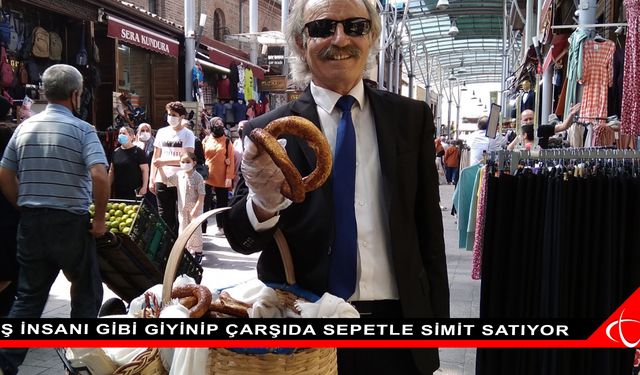 İş insanı gibi giyinip çarşıda sepetle simit satıyor