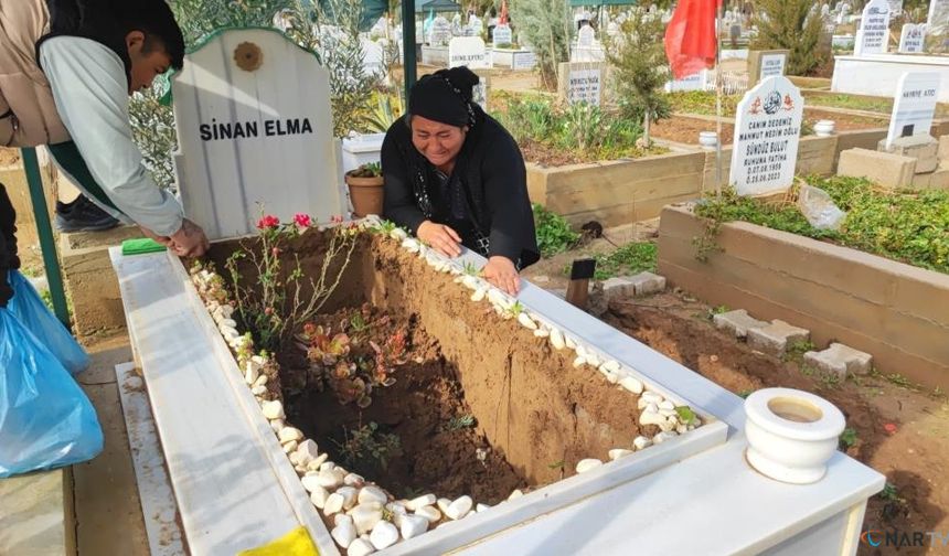 Yağışta oğlunun mezarı çöken anne gözyaşlarına boğuldu